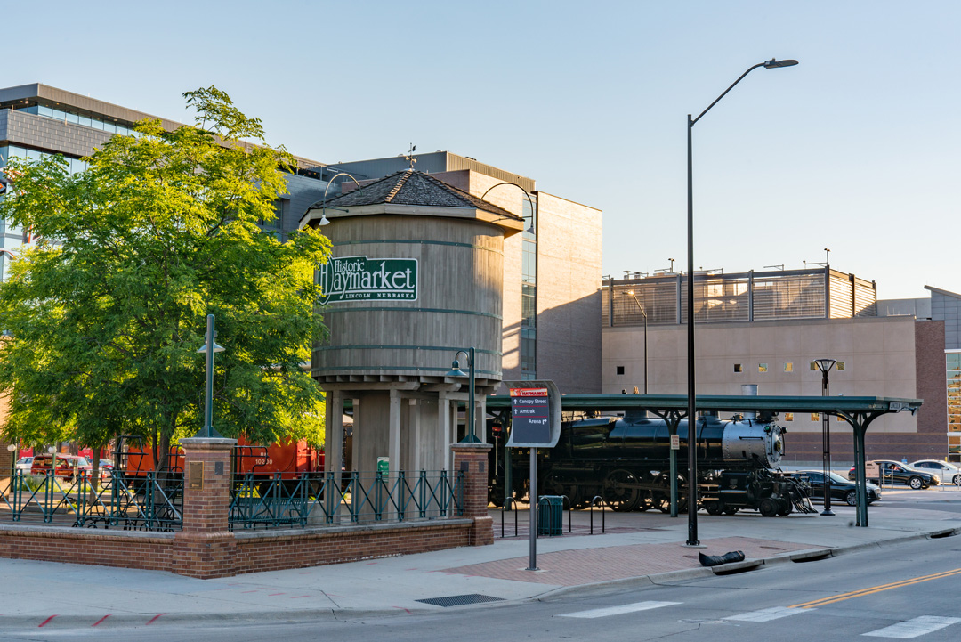 photo of Historic Haymarket District and a railroad under clear skies